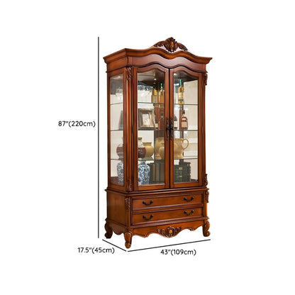 Vitrine traditionnelle en bois brun avec portes vitrées