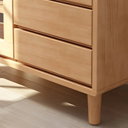 Vitrine en bois clair à plusieurs tiroirs avec portes vitrées