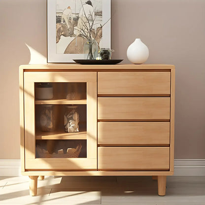 Vitrine en bois clair à plusieurs tiroirs avec portes vitrées