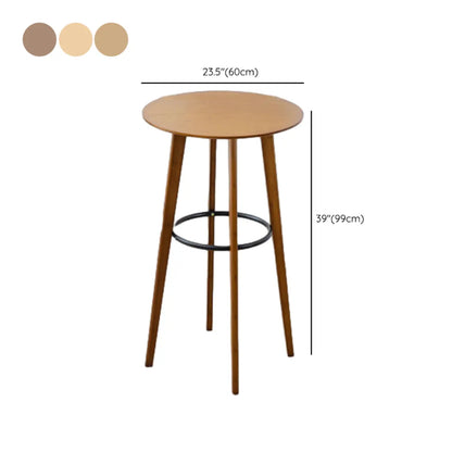 Tables de bar rondes en bois brun à pieds hauts