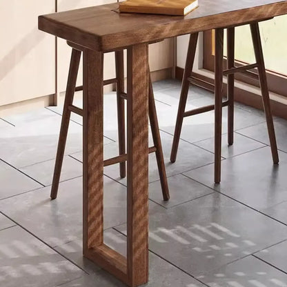Table de bar décontractée en bois brun avec piètement traîneau