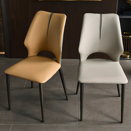 Chaise de salle à manger moderne sans accoudoirs, dossier ouvert, en similicuir.