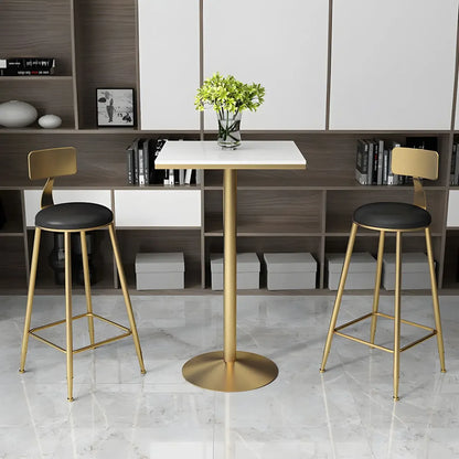 Table de bar élégante en marbre nordique avec piètement en métal doré
