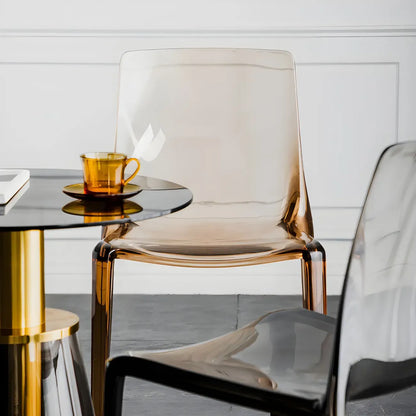 Chaise de salle à manger sans accoudoirs à dossier bas en acrylique ambré
